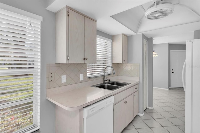 9529 Bunker Hill Ct Unit 9529, New Port Richey, FL 34655 - kitchen featuring white appliances, a sink, light countertops, light tile patterned floors, and decorative backsplash