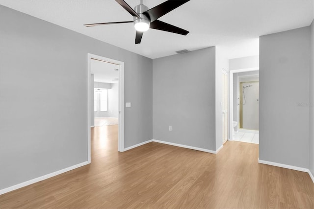 9529 Bunker Hill Ct Unit 9529, New Port Richey, FL 34655 - spare room featuring a ceiling fan, light wood-type flooring, and baseboards