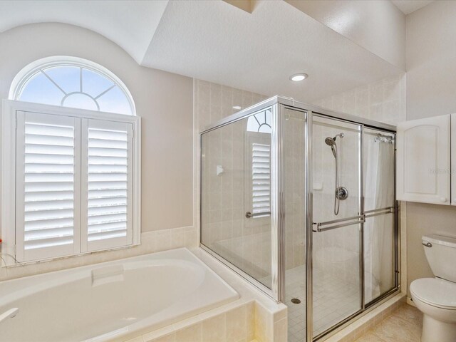 13922 Talmage Loop, Hudson, FL 34667 - full bath featuring toilet, a bath, a shower stall, and tile patterned floors