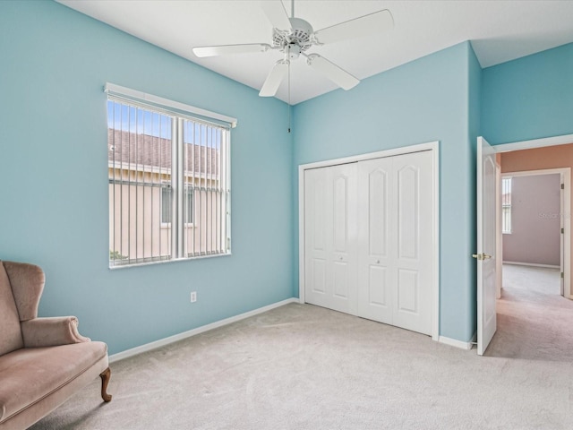 13922 Talmage Loop, Hudson, FL 34667 - living area with carpet floors, baseboards, and a ceiling fan