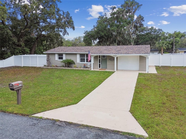 7545 Banner St, New Port Richey, FL 34653 - ranch-style home with a garage and driveway