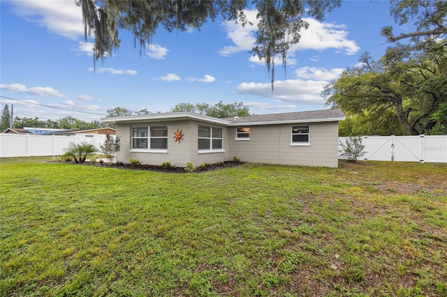 7545 Banner St, New Port Richey, FL 34653 - rear view of house with a gate