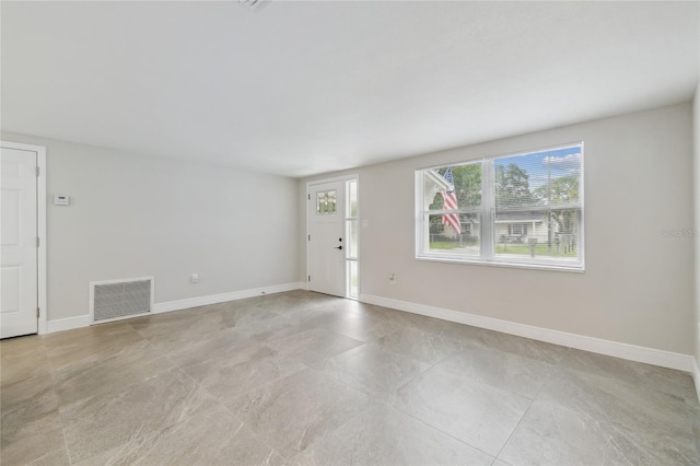 7545 Banner St, New Port Richey, FL 34653 - unfurnished living room featuring baseboards