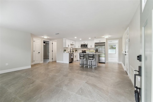 7545 Banner St, New Port Richey, FL 34653 - living area with recessed lighting and baseboards