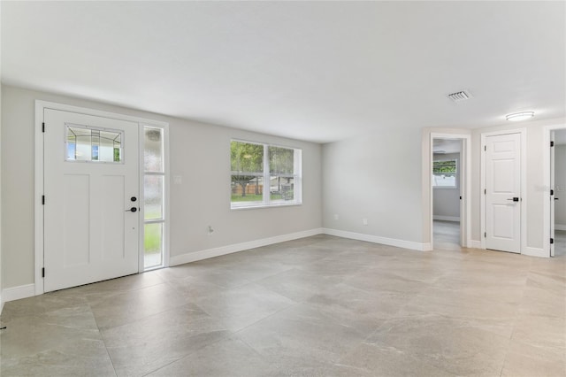 7545 Banner St, New Port Richey, FL 34653 - entrance foyer with healthy amount of natural light and baseboards