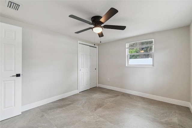 7545 Banner St, New Port Richey, FL 34653 - unfurnished bedroom featuring baseboards, a closet, and ceiling fan