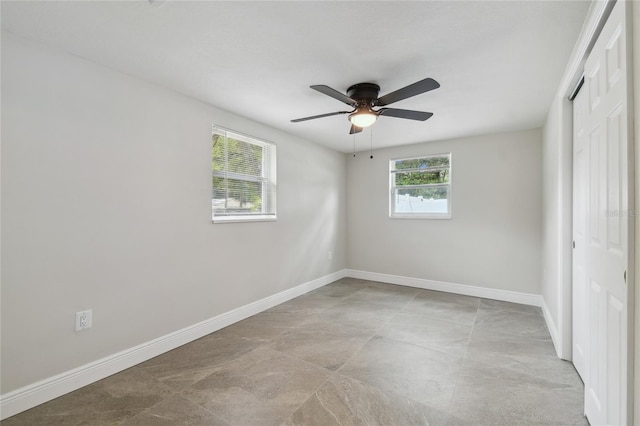 7545 Banner St, New Port Richey, FL 34653 - unfurnished bedroom featuring a closet, baseboards, and ceiling fan