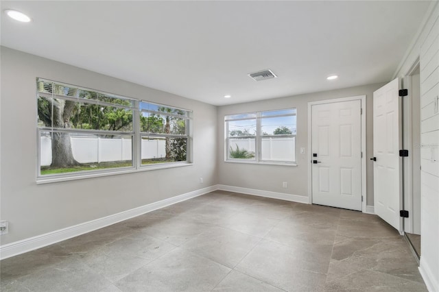 7545 Banner St, New Port Richey, FL 34653 - foyer entrance featuring recessed lighting, baseboards, and light tile patterned flooring
