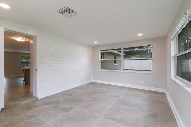 7545 Banner St, New Port Richey, FL 34653 - unfurnished room featuring healthy amount of natural light, baseboards, and recessed lighting