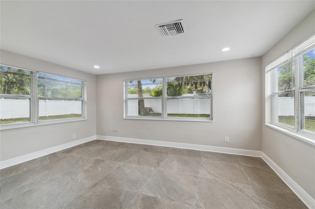 7545 Banner St, New Port Richey, FL 34653 - empty room with baseboards and recessed lighting