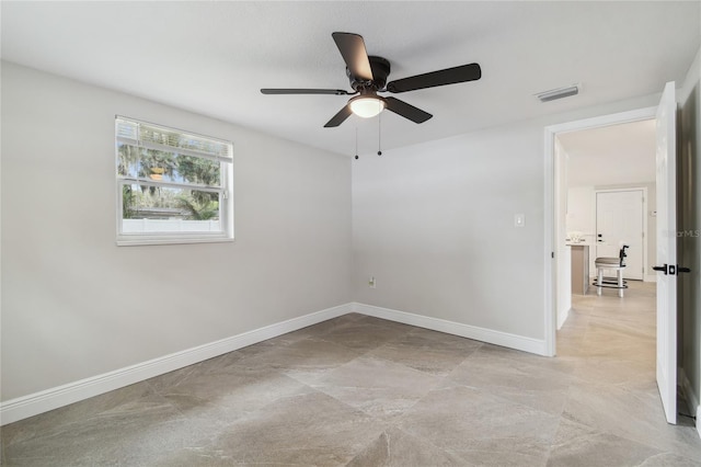 7545 Banner St, New Port Richey, FL 34653 - empty room featuring ceiling fan and baseboards
