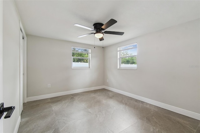 7545 Banner St, New Port Richey, FL 34653 - empty room featuring healthy amount of natural light, ceiling fan, and baseboards