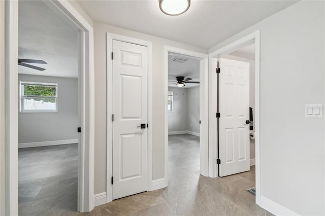 7545 Banner St, New Port Richey, FL 34653 - corridor featuring baseboards and light tile patterned flooring