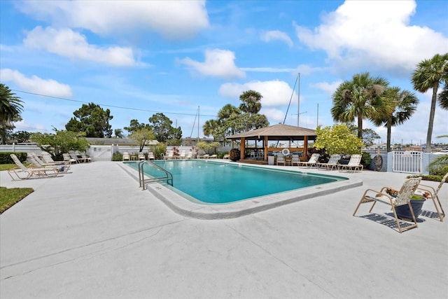 4939 Floramar Ter Unit 611, New Port Richey, FL 34652 - community pool featuring a gazebo and a patio area