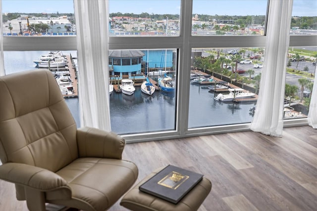 4939 Floramar Ter Unit 611, New Port Richey, FL 34652 - living area featuring wood finished floors and a water view