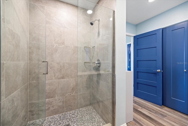 4939 Floramar Ter Unit 611, New Port Richey, FL 34652 - bathroom with a shower stall and wood finished floors