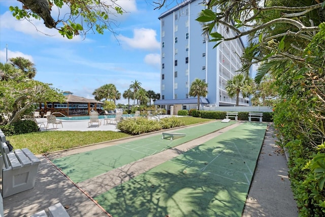 4939 Floramar Ter Unit 611, New Port Richey, FL 34652 - surrounding community with a swimming pool and shuffleboard