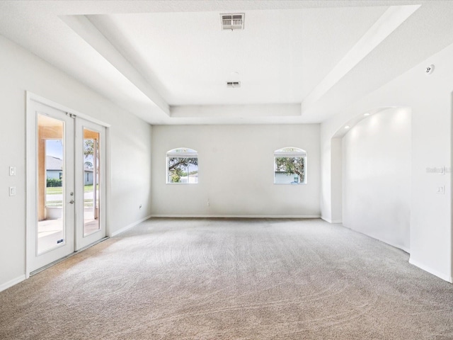 4266 High Ridge Ave, Spring Hill, FL 34609 - unfurnished room with a raised ceiling, carpet, french doors, and baseboards