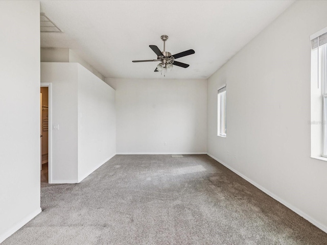 4266 High Ridge Ave, Spring Hill, FL 34609 - carpeted empty room with healthy amount of natural light, ceiling fan, and baseboards