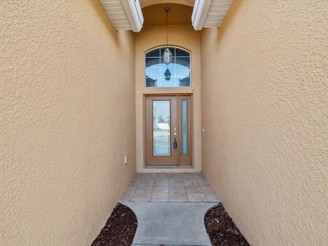 4266 High Ridge Ave, Spring Hill, FL 34609 - view of exterior entry with stucco siding