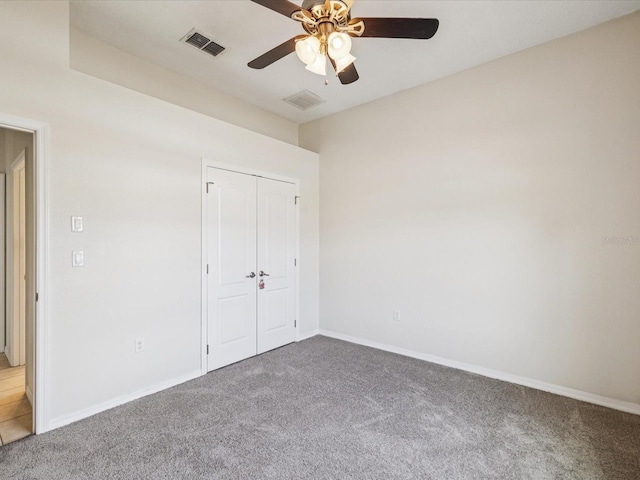 4266 High Ridge Ave, Spring Hill, FL 34609 - unfurnished bedroom with carpet flooring, baseboards, and a closet