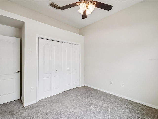 4266 High Ridge Ave, Spring Hill, FL 34609 - unfurnished bedroom featuring carpet floors, a closet, baseboards, and a ceiling fan