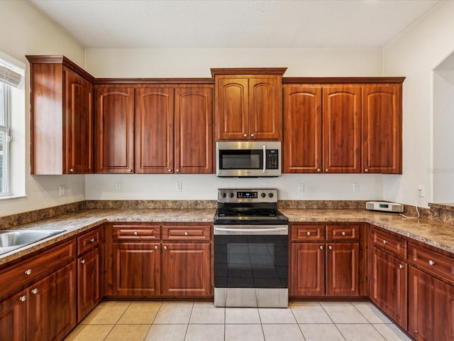 4266 High Ridge Ave, Spring Hill, FL 34609 - kitchen with stainless steel appliances, dark countertops, light tile patterned flooring, and a sink