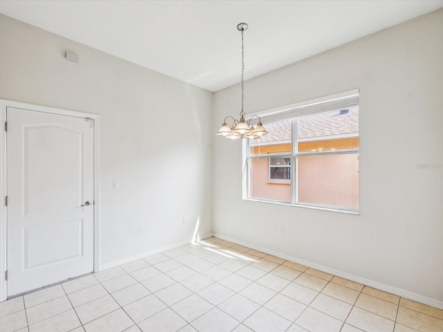 4266 High Ridge Ave, Spring Hill, FL 34609 - spare room with a chandelier, light tile patterned flooring, and baseboards