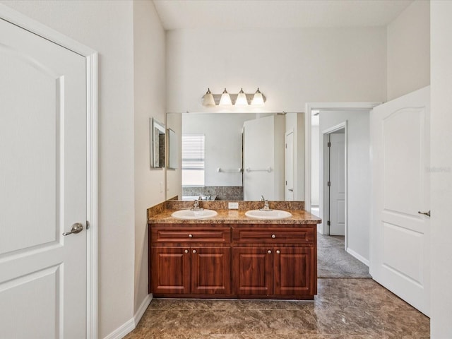 4266 High Ridge Ave, Spring Hill, FL 34609 - bathroom featuring double vanity and baseboards