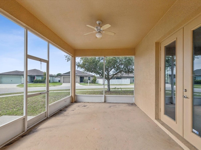 4266 High Ridge Ave, Spring Hill, FL 34609 - unfurnished sunroom with french doors, a ceiling fan, and a residential view