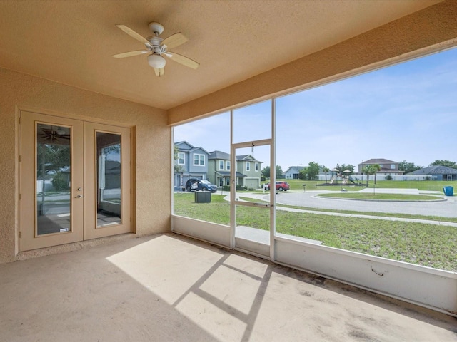 4266 High Ridge Ave, Spring Hill, FL 34609 - unfurnished sunroom featuring a residential view, a ceiling fan, and french doors