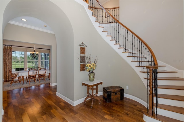 10531 Pontofino Cir, Trinity, FL 34655 - stairway with wood finished floors, a chandelier, crown molding, baseboards, and recessed lighting