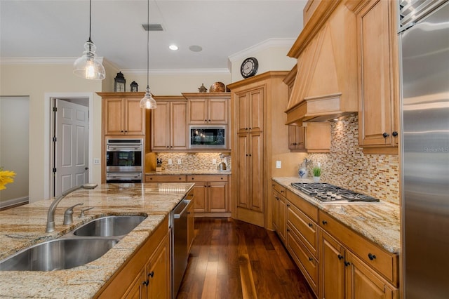 10531 Pontofino Cir, Trinity, FL 34655 - kitchen featuring appliances with stainless steel finishes, a sink, custom exhaust hood, crown molding, and hanging light fixtures