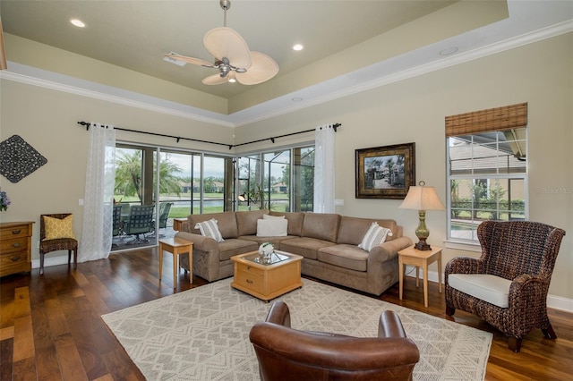 10531 Pontofino Cir, Trinity, FL 34655 - living room featuring dark wood finished floors, crown molding, a ceiling fan, a raised ceiling, and recessed lighting