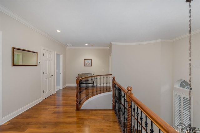 10531 Pontofino Cir, Trinity, FL 34655 - hallway with an upstairs landing, wood finished floors, recessed lighting, crown molding, and baseboards
