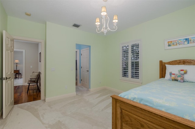 10531 Pontofino Cir, Trinity, FL 34655 - carpeted bedroom featuring a chandelier and baseboards