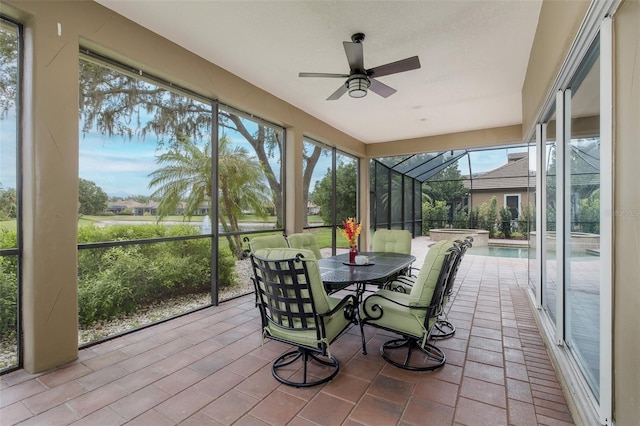 10531 Pontofino Cir, Trinity, FL 34655 - sunroom / solarium with ceiling fan, a hot tub, and outdoor dining space