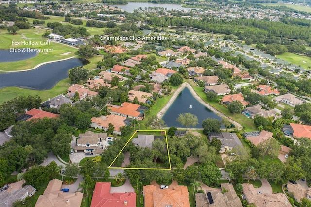 10531 Pontofino Cir, Trinity, FL 34655 - aerial view of residential area with a nearby body of water, property parcel outlined, and a local golf course