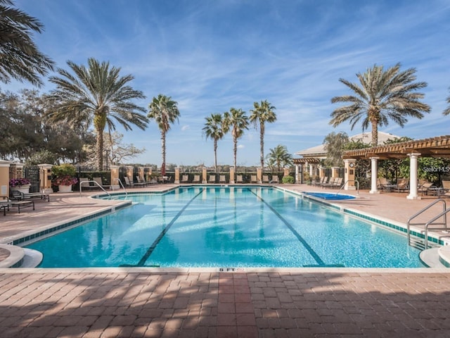10531 Pontofino Cir, Trinity, FL 34655 - community pool featuring a patio area and a pergola