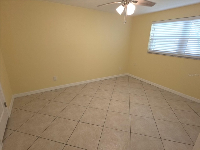 7313 Hatteras Dr, Hudson, FL 34667 - unfurnished room with a ceiling fan, light tile patterned flooring, and baseboards