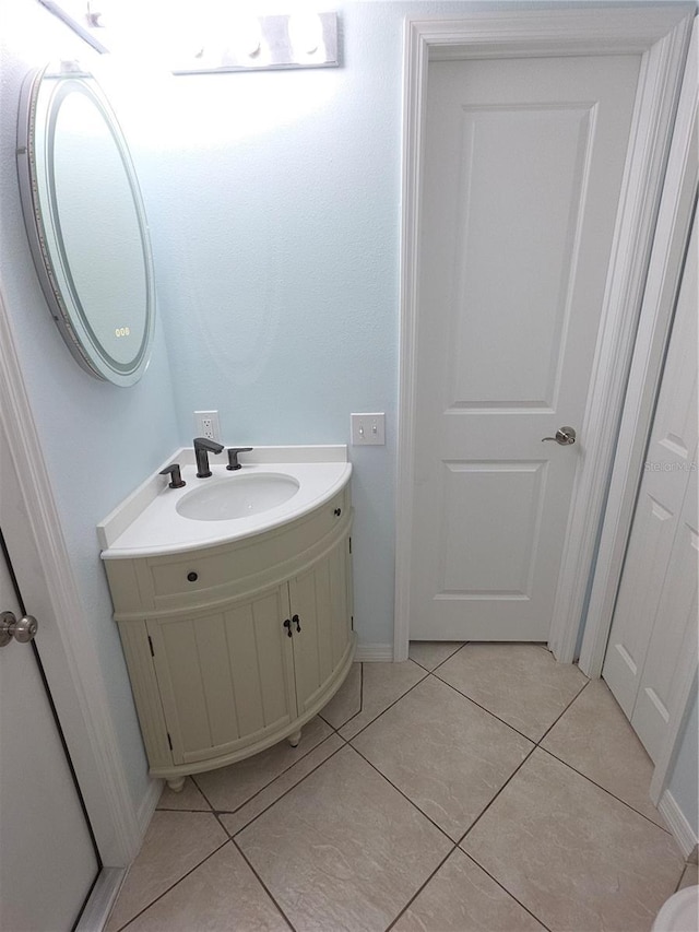 7313 Hatteras Dr, Hudson, FL 34667 - bathroom with vanity, tile patterned flooring, and baseboards