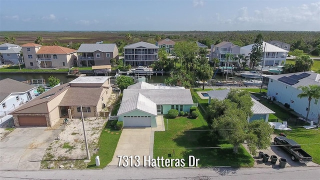 7313 Hatteras Dr, Hudson, FL 34667 - aerial perspective of suburban area featuring a large body of water