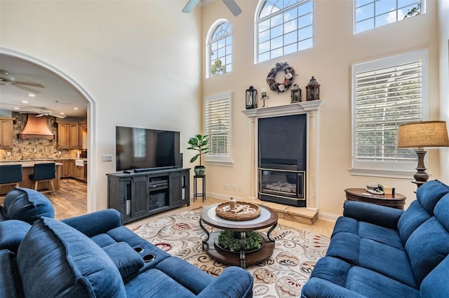 2880 Chelsea Pl N, Clearwater, FL 33759 - living area with a ceiling fan, a high ceiling, and plenty of natural light