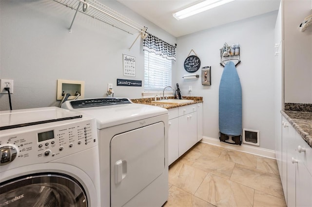 2880 Chelsea Pl N, Clearwater, FL 33759 - laundry room featuring washer and clothes dryer, cabinet space, and light marble finish floors