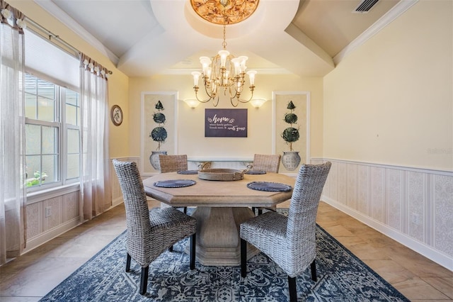 2880 Chelsea Pl N, Clearwater, FL 33759 - dining room with a chandelier and wainscoting