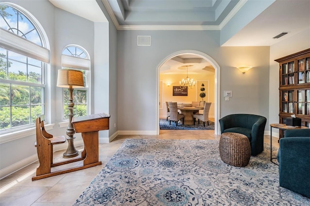 2880 Chelsea Pl N, Clearwater, FL 33759 - sitting room featuring light tile patterned flooring, healthy amount of natural light, arched walkways, and ornamental molding