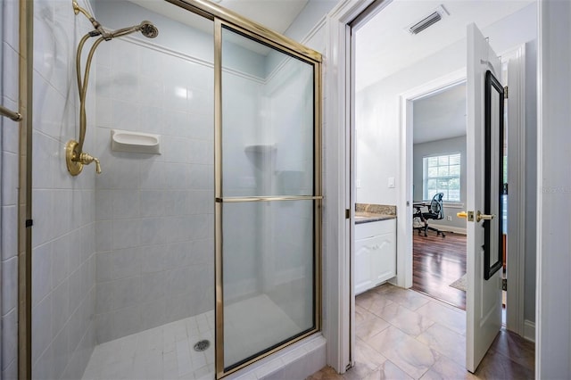 2880 Chelsea Pl N, Clearwater, FL 33759 - full bathroom featuring a stall shower, vanity, and marble finish floors
