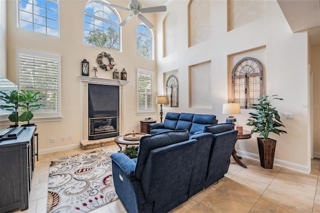 2880 Chelsea Pl N, Clearwater, FL 33759 - living room featuring a towering ceiling, ceiling fan, and light tile patterned flooring