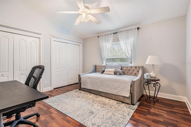 2880 Chelsea Pl N, Clearwater, FL 33759 - bedroom with multiple closets, lofted ceiling, an office area, dark wood finished floors, and a ceiling fan