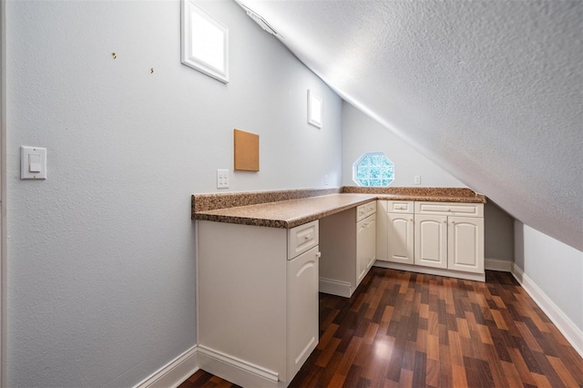 2880 Chelsea Pl N, Clearwater, FL 33759 - bonus room with a textured ceiling, vaulted ceiling, and dark wood finished floors